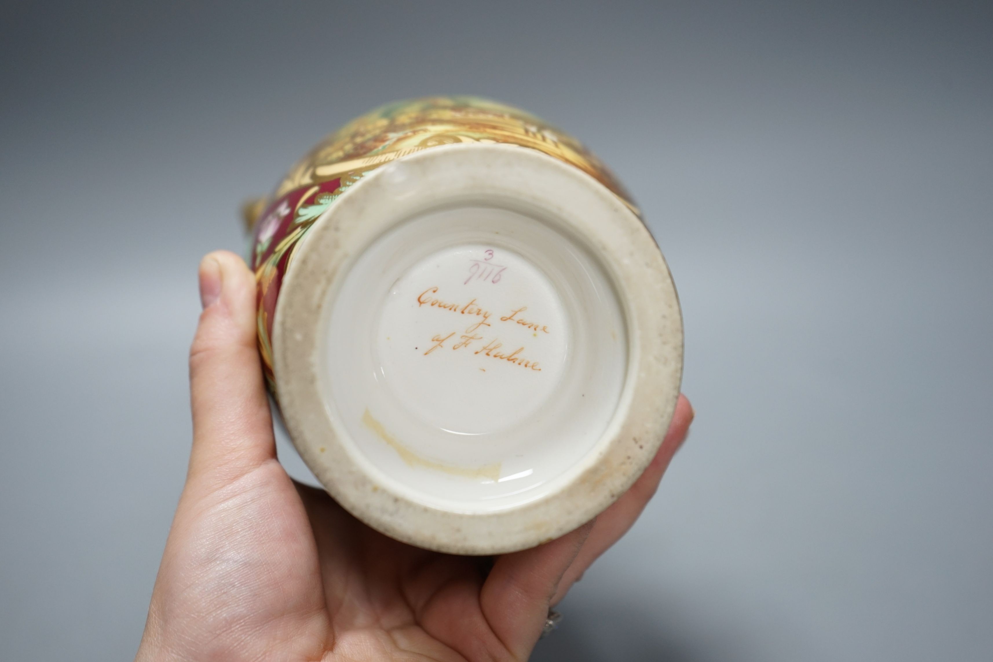 A 19th century English bone china two handled vase, decorated with a central cartouche, in distinctly signed on base, 21.5cms high